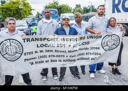 Miami Florida,Liberty City,Martin Luther King Jr. Parade,partecipante,comunità Black banner,Transport Workers Union,uomo uomini maschio,donna donne,FL Foto Stock