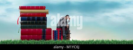 Composito digitale di un uomo seduto sui libri Foto Stock