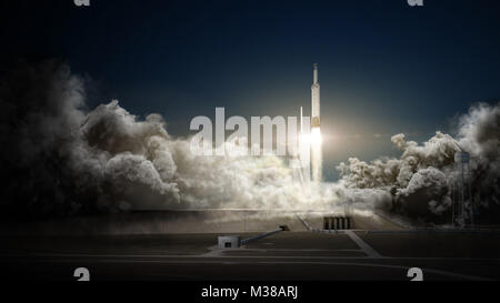 Il razzo Falcon Heavy lancia la capsula Dragon in orbita, segnando una pietra miliare per SpaceX. I booster del primo stadio atterrano sulla piattaforma di atterraggio ASDS dopo il successo dell'implementazione. Foto Stock