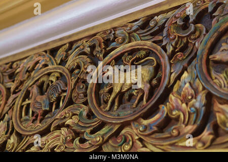 Cane zodiaco cinese scultura in legno Foto Stock