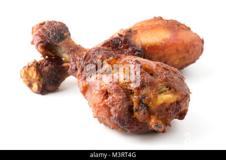 Pollo arrosto gambe su di uno sfondo bianco Foto Stock