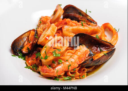 Frutti di mare saute misti Foto Stock