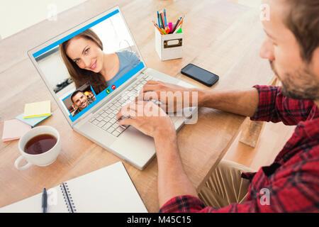 Immagine composita di imprenditore creativo digitando su laptop Foto Stock