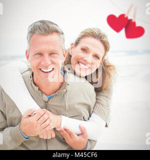 Immagine composita di sorridere giovane azienda uno un altro Foto Stock