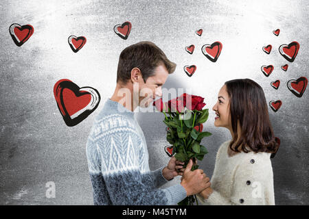 Immagine composita della coppia romantica holding rose rosse Foto Stock