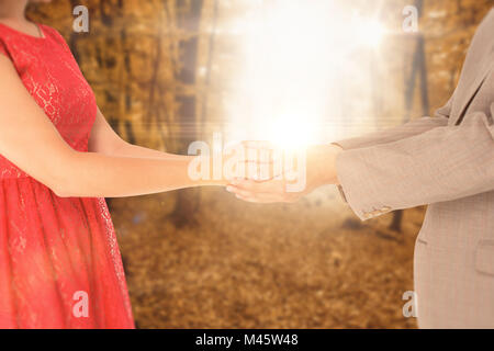 Immagine composita del hipster giovane in piedi mano nella mano Foto Stock