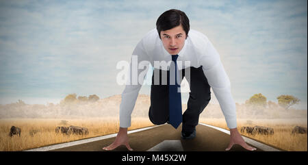 Immagine composita di un commerciante in posizione in volata Foto Stock