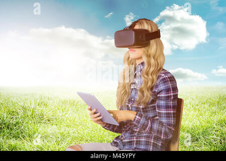 Immagine composita di pretty casual lavoratore utilizzando oculus rift Foto Stock