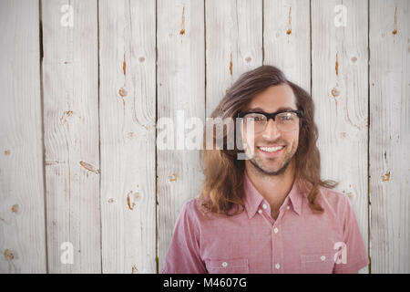 Immagine composita di felice hipster indossando occhiali Foto Stock