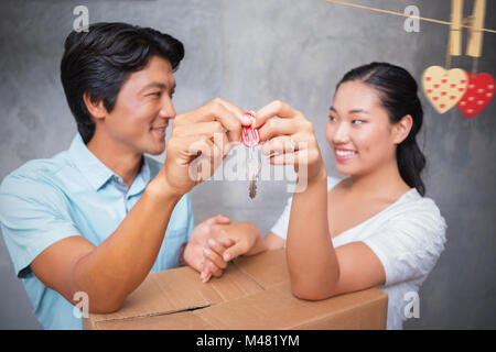 Immagine composita di cuori appesi su una linea Foto Stock