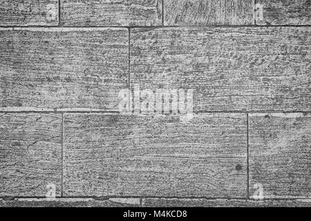 Close-up di pavimentazione in pietra vista dal di sopra in bianco e nero con la vignettatura. Foto Stock