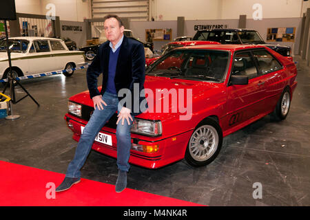 Attore, Philip Glenister in posa con un Audi quattro, che ha guidato come il personaggio 'gene Hunt', nella serie televisiva della BBC One 'Ashes to Ashes', durante il London Classic Car Show 2018 Foto Stock