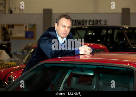 Attore, Philip Glenister in posa con un Audi quattro, che ha guidato come il personaggio 'gene Hunt', nella serie televisiva della BBC One 'Ashes to Ashes' al London Classic Car Show 2018 Foto Stock