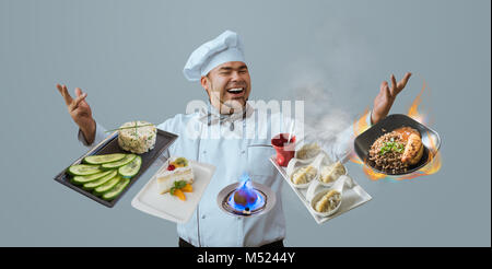 Lo Chef giocoleria con i pasti Foto Stock