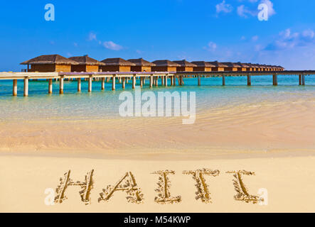 Parola Haiti sulla spiaggia Foto Stock