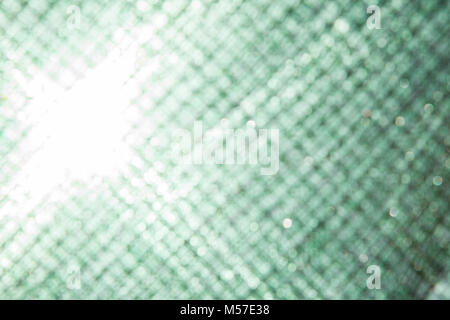 Green net texture con sole che splende attraverso. Foto Stock