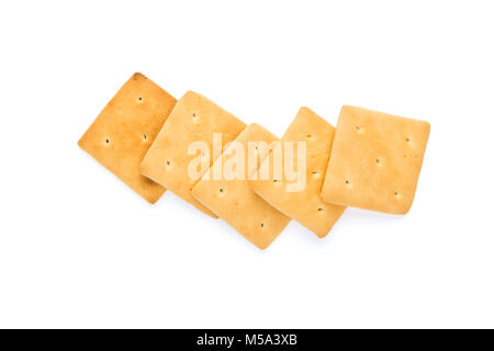 Una sana prima colazione, cracker allineate in una fila, isolato su sfondo bianco Foto Stock