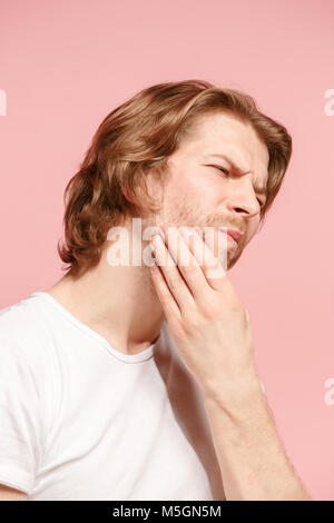 Giovane uomo è avere mal di denti. Foto Stock