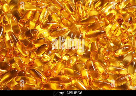 Olio di fegato di merluzzo capsule texture di sfondo Foto Stock