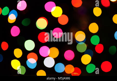 Abstract le luci di Natale come sfondo su nero Foto Stock