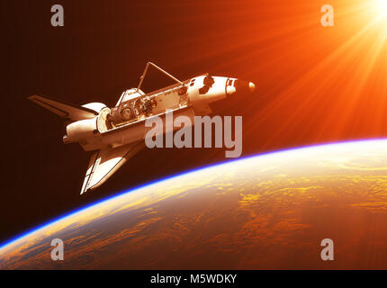 Space Shuttle sotto i raggi del sole che sorge Foto Stock
