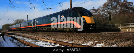 In inverno la neve, 180 classe, Grand Central treni, East Coast Main Line Railway, Peterborough, CAMBRIDGESHIRE, England, Regno Unito Foto Stock