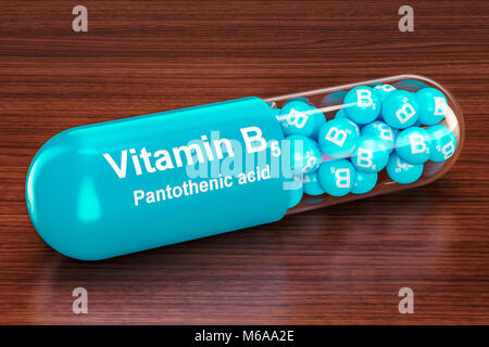 Capsula di vitamina B5 sul tavolo di legno. Il rendering 3D Foto Stock