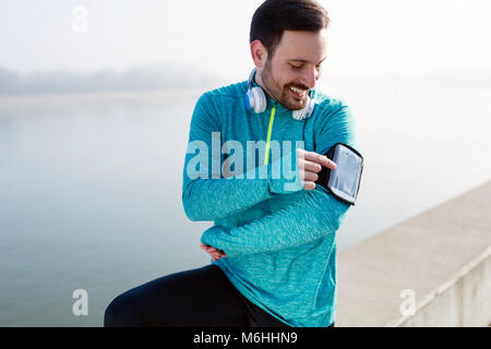 La buona musica è la motivazione per la corsa Foto Stock