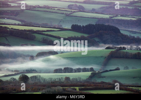Cutcombe e delle frange di Exmoor da Dunkery beacon all'alba, Somerset, Inghilterra, Regno Unito Foto Stock