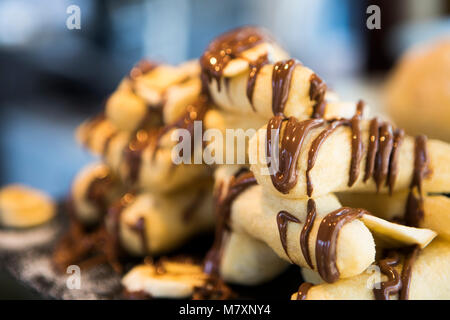 Banana e cioccolato churros. Foto Stock