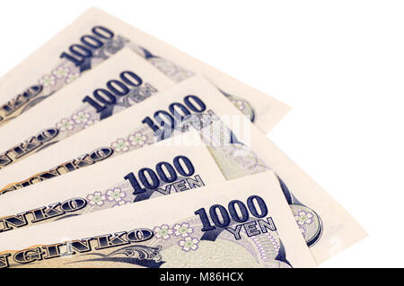 Diverse 1000 Giapponese Yen banconote isolato su uno sfondo bianco. Foto Stock