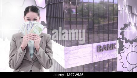 Donna che mantiene il denaro e gli edifici alti banca con cog sullo sfondo degli ingranaggi Foto Stock