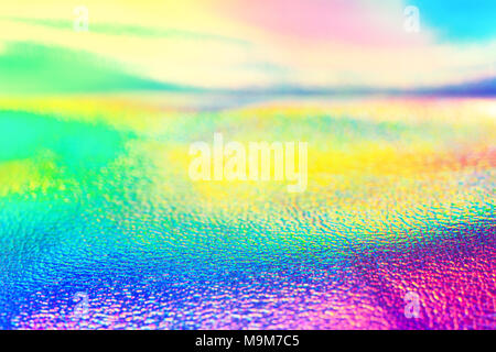 Rainbow real foil olografico neon di texture di sfondo. Neon vibranti texture. Sfondo alla moda. Foto Stock