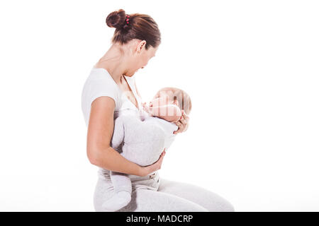 Giovane madre tenendo il suo bambino Foto Stock