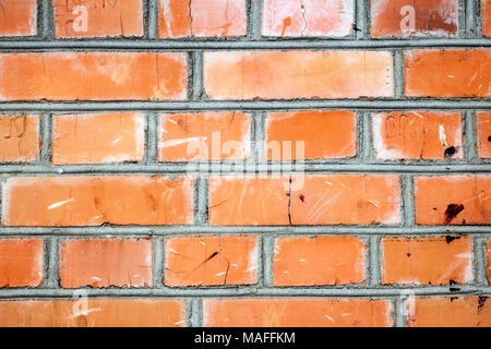 Superficie di una parete di mattoni fatti di moderno rosso mattone Foto Stock