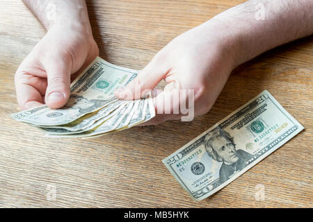 US dollar bills. Person counting dollars. Foto Stock