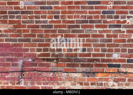 Vecchio, rosso muro di mattoni per lo sfondo. Foto Stock