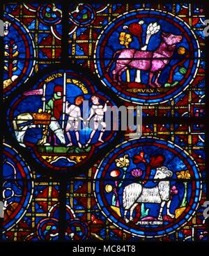 I segni zodiacali, Ariete, Toro e Gemelli, a fianco di un'immagine del mese di maggio. Xiii secolo il vetro macchiato - dettaglio dalla finestra zodiacale nella parete sud della cattedrale di Chartres. Foto Stock
