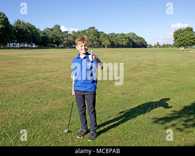 Golfista junior Foto Stock