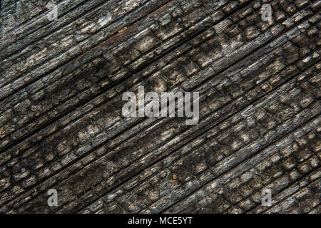 Bruciò legno texture di sfondo vecchia scheda Foto Stock