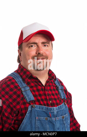 Workman maschio in bib tute, maglietta di flanella, e hat. Foto Stock