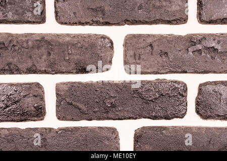 Decorazione nera parete di mattoni di argilla bianca cuciture close-up Foto Stock