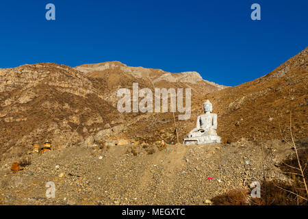 Shakyamuni Buddha statua di pietra, Muktinath Foto Stock