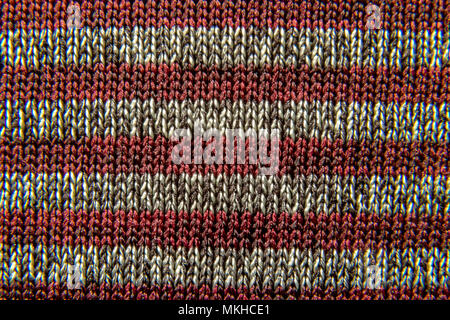 Immagine di sfondo di un tessuto di colore rosso-grigio tessitura a strisce di close-up Foto Stock
