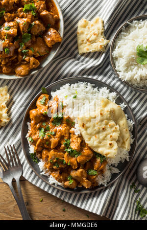 In casa burro indiano di pollo con riso e pane Naan Foto Stock