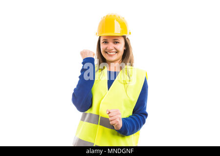 Giovani allegro attraente ingegnere femmina o di un architetto rendendo la felicità come gesto di successo del lavoro concetto isolato su sfondo bianco Foto Stock