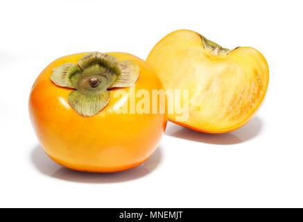 Intero e fette di frutta sharon Foto Stock