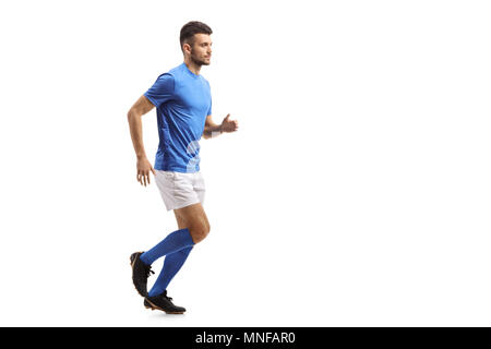 Lunghezza piena ripresa di profilo di un giocatore di calcio in esecuzione isolati su sfondo bianco Foto Stock