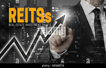 Reit del concetto è illustrato da parte dell'imprenditore. Foto Stock