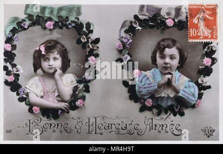 Il francese anno nuovo cartolina raffigurante due ragazze giovani 1900 Foto Stock